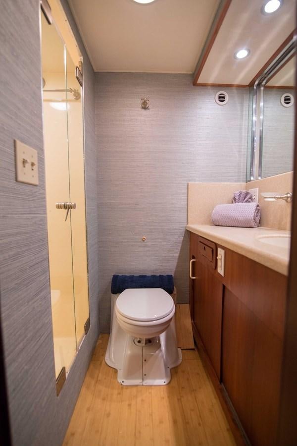 a bathroom with a toilet and sink aboard NEXT DEAL Yacht for Sale