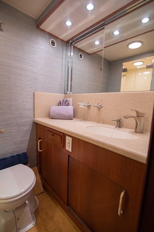 a bathroom with a sink and a toilet aboard NEXT DEAL Yacht for Sale