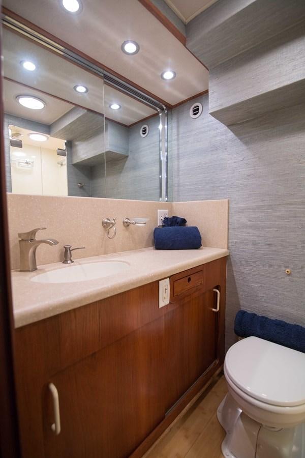 a bathroom with a mirror and a sink aboard NEXT DEAL Yacht for Sale