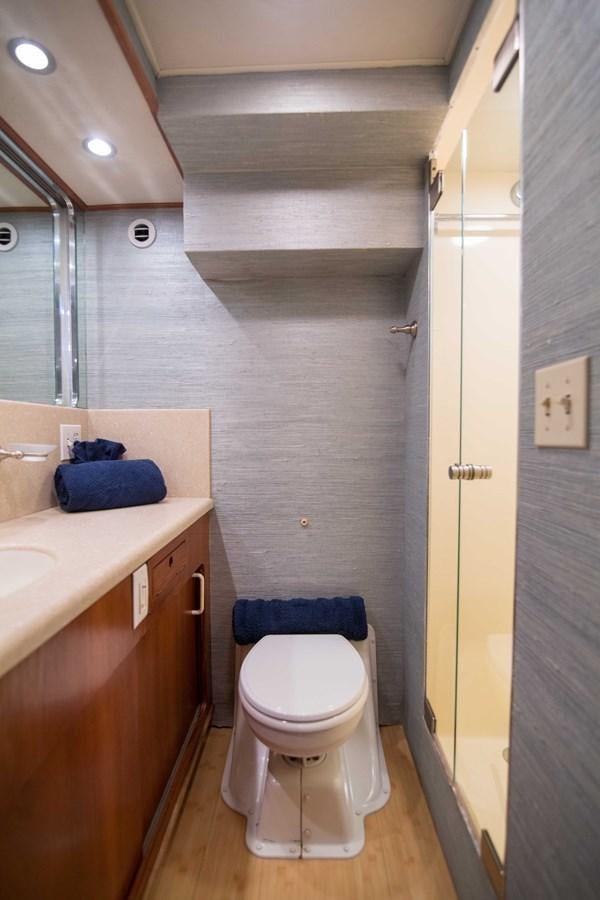 a bathroom with a toilet and sink aboard NEXT DEAL Yacht for Sale
