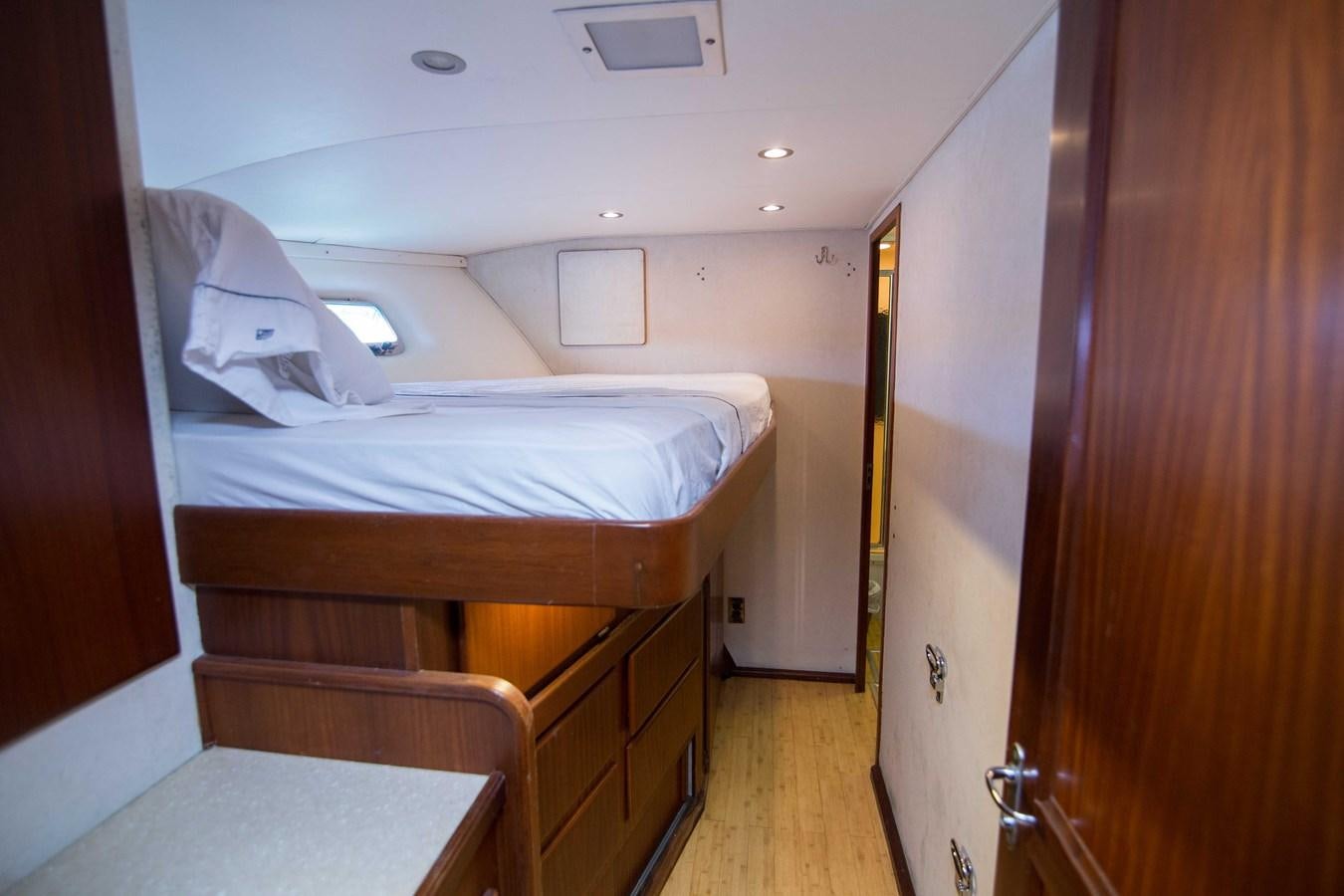 a room with a bed and a desk aboard NEXT DEAL Yacht for Sale