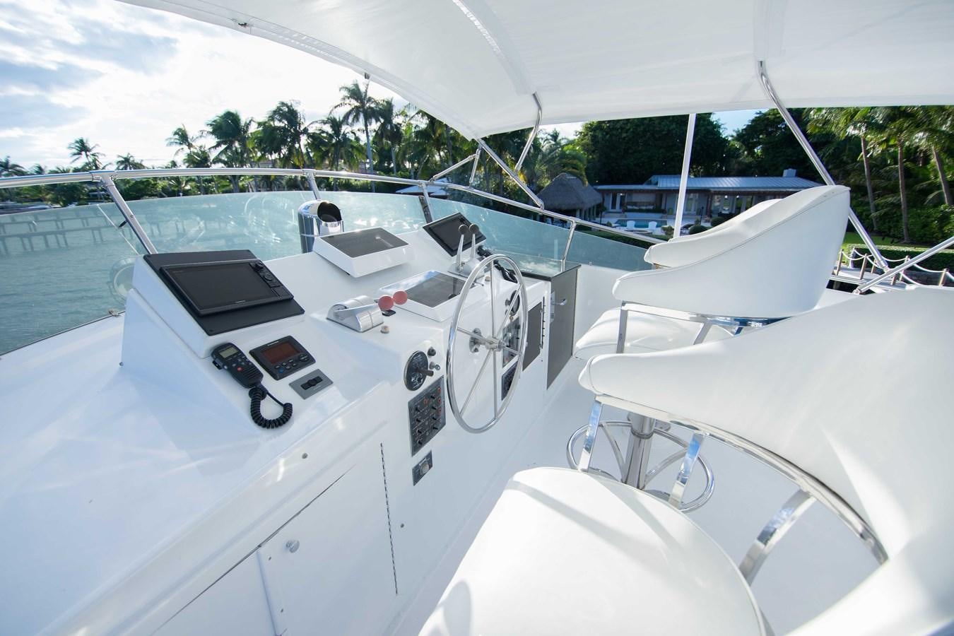 a boat with a steering wheel aboard NEXT DEAL Yacht for Sale