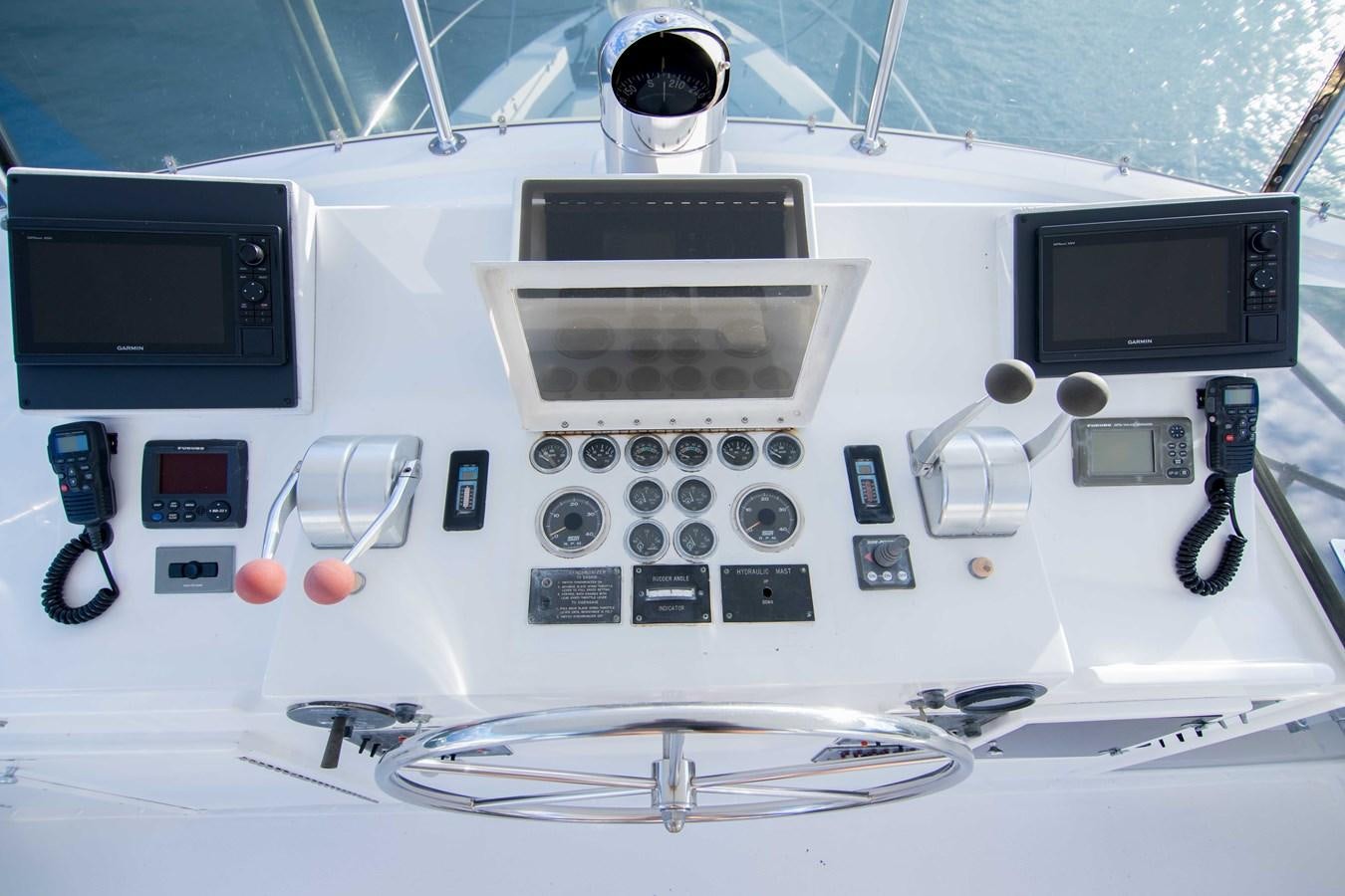 a white rectangular object with a screen and buttons and a device on it aboard NEXT DEAL Yacht for Sale