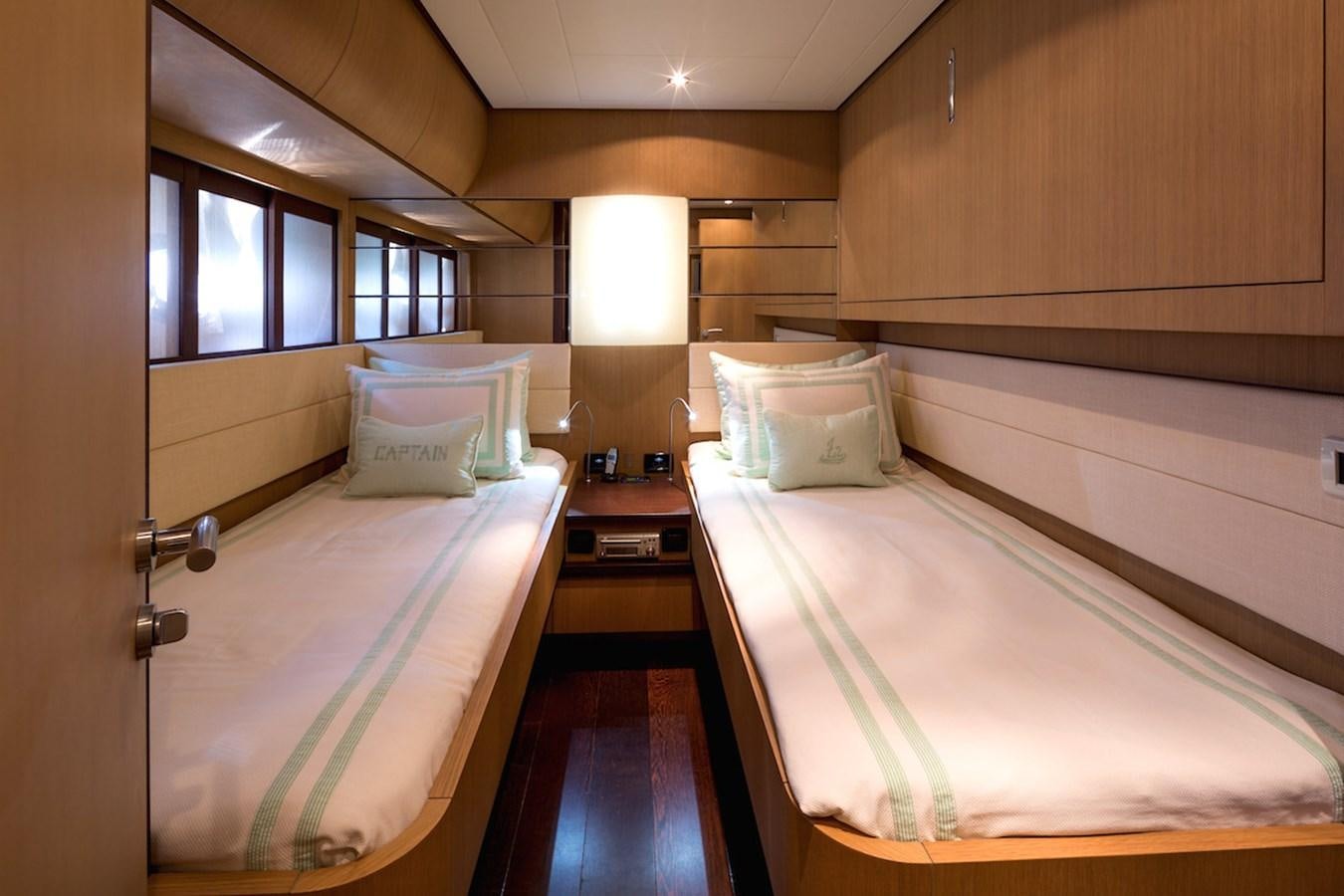 a couple of beds in a room aboard ONE Yacht for Sale