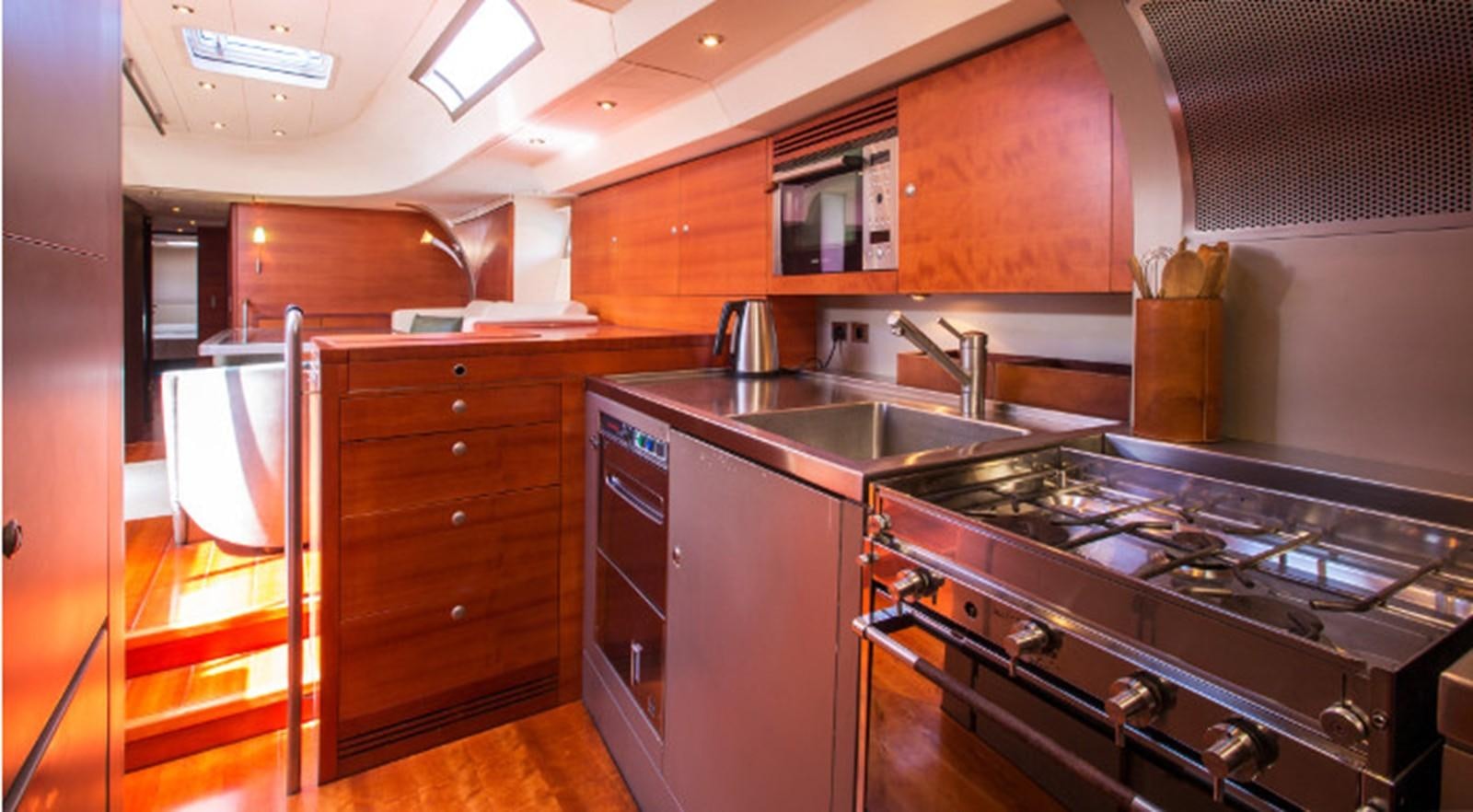 a kitchen with a stove and oven aboard ZURBAGAN Yacht for Sale