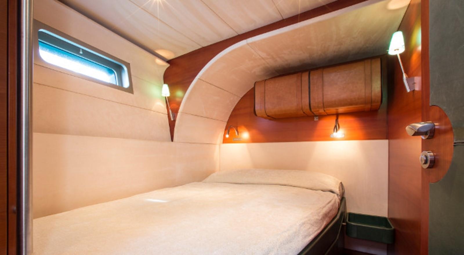 a bed with a white sheet aboard ZURBAGAN Yacht for Sale