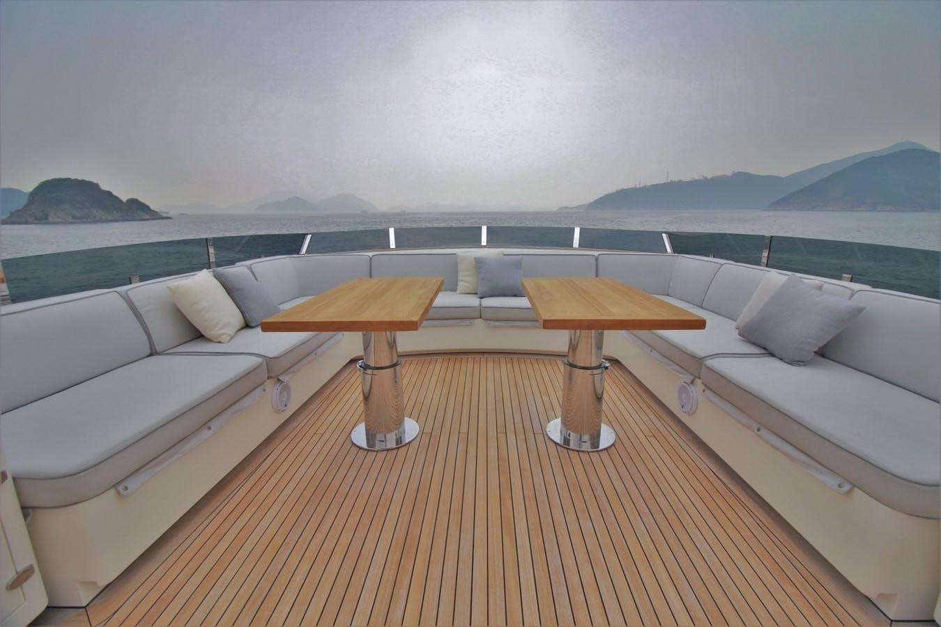 a room with a bed and a table aboard VERSILCRAFT V86 Yacht for Sale