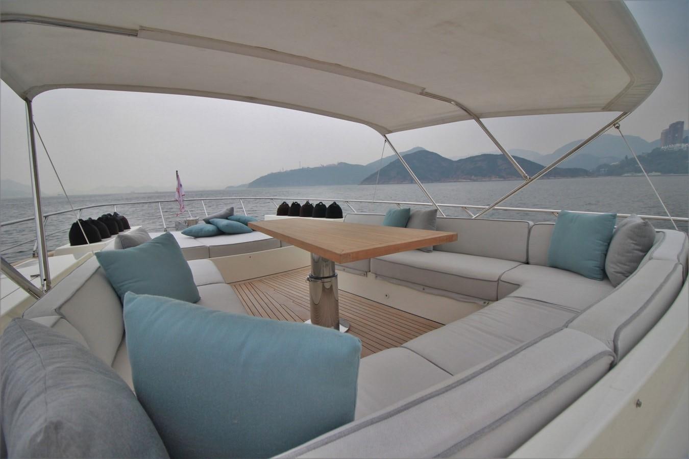 a cat lying on a couch aboard VERSILCRAFT V86 Yacht for Sale