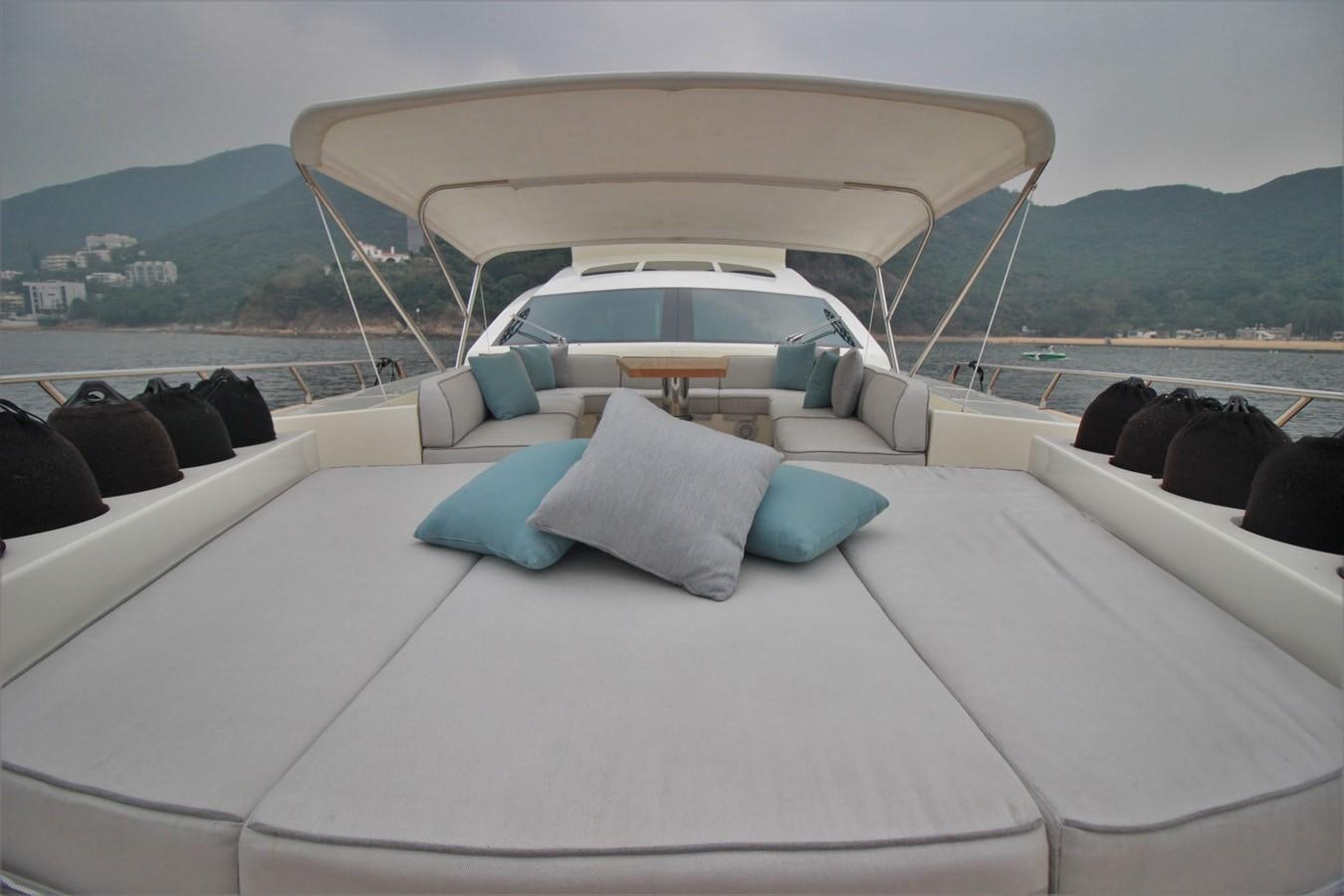 a white car with a white roof aboard VERSILCRAFT V86 Yacht for Sale