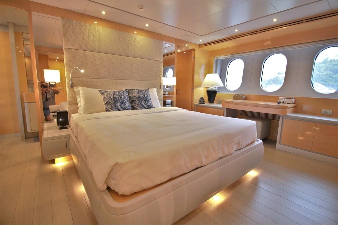 a bedroom with a bed and a desk aboard VERSILCRAFT V86 Yacht for Sale