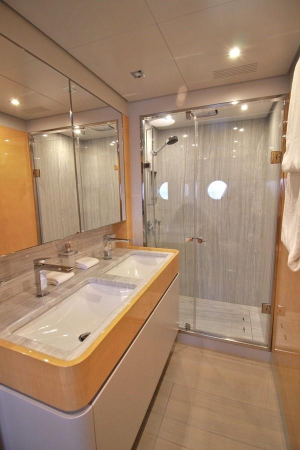a bathroom with a shower and sink aboard VERSILCRAFT V86 Yacht for Sale