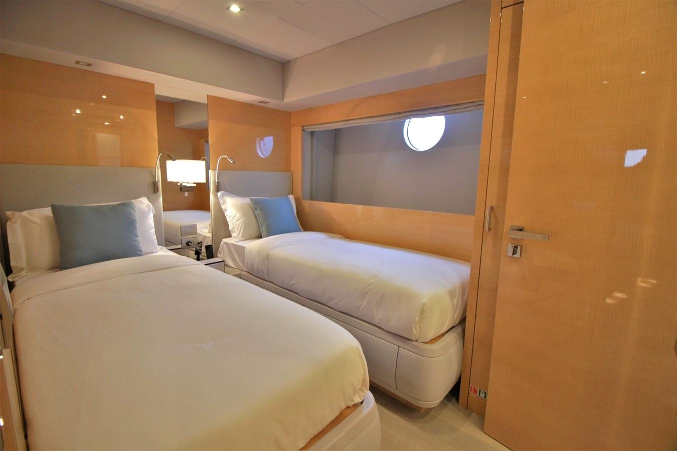 a room with two beds aboard VERSILCRAFT V86 Yacht for Sale