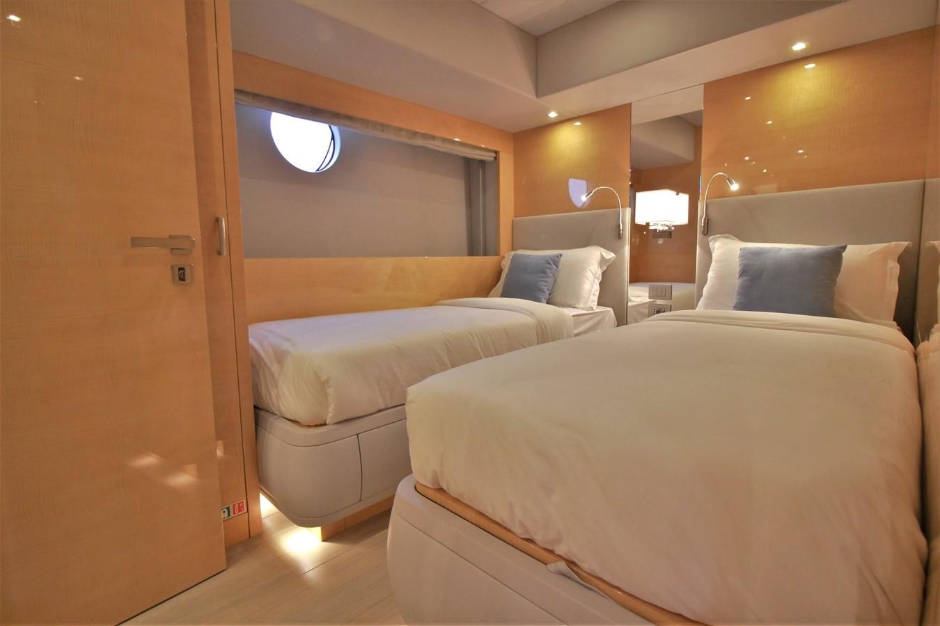 a room with two beds aboard VERSILCRAFT V86 Yacht for Sale