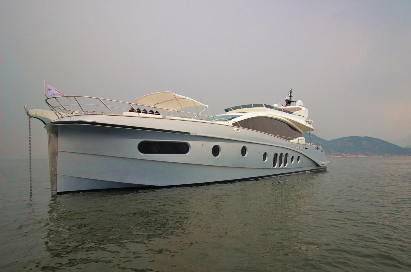 a white boat in the water aboard VERSILCRAFT V86 Yacht for Sale