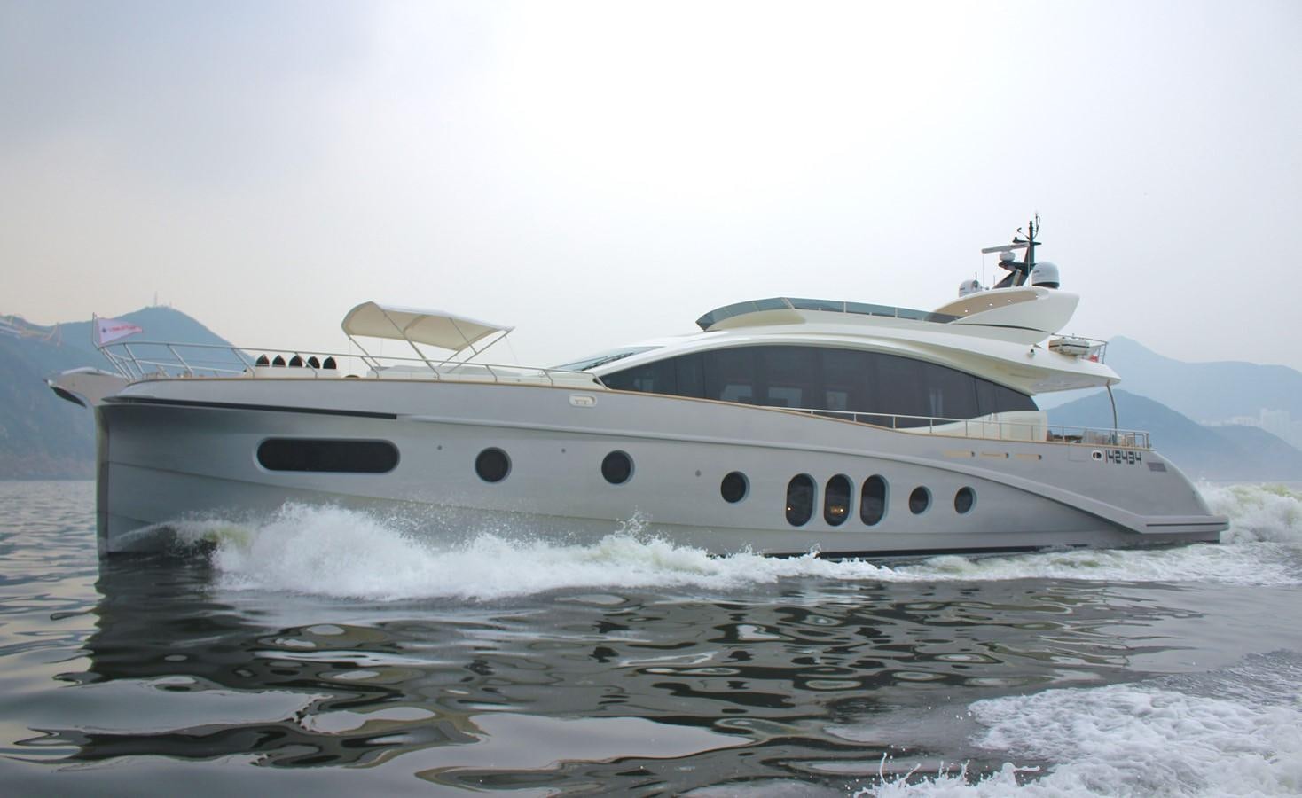 a white yacht in the water aboard VERSILCRAFT V86 Yacht for Sale