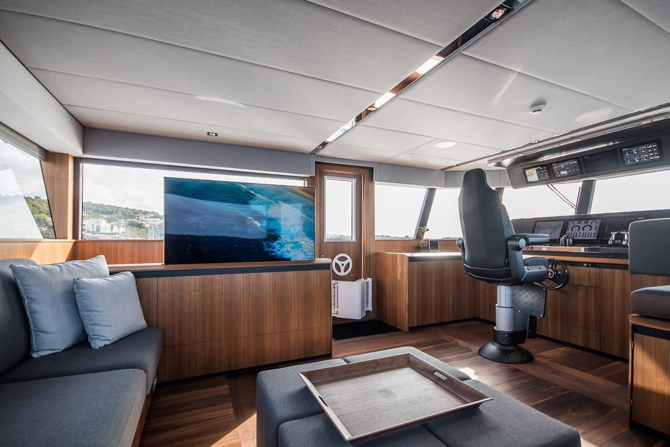 a room with a couch and a television aboard YXT 27 Yacht for Sale