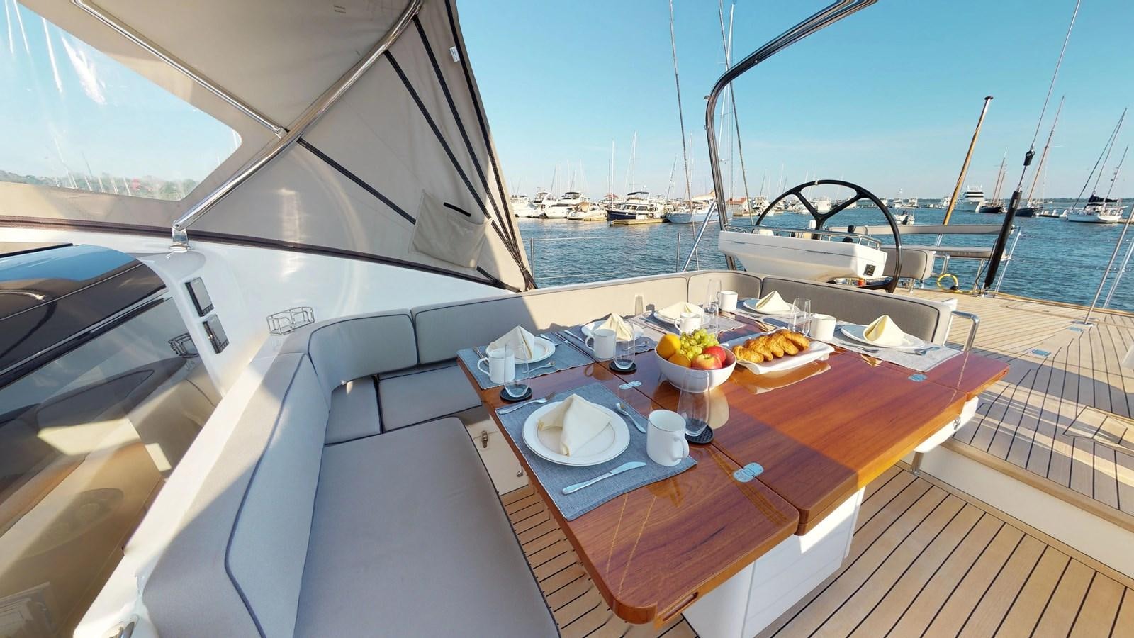 a table with food on it aboard AYNI Yacht for Sale