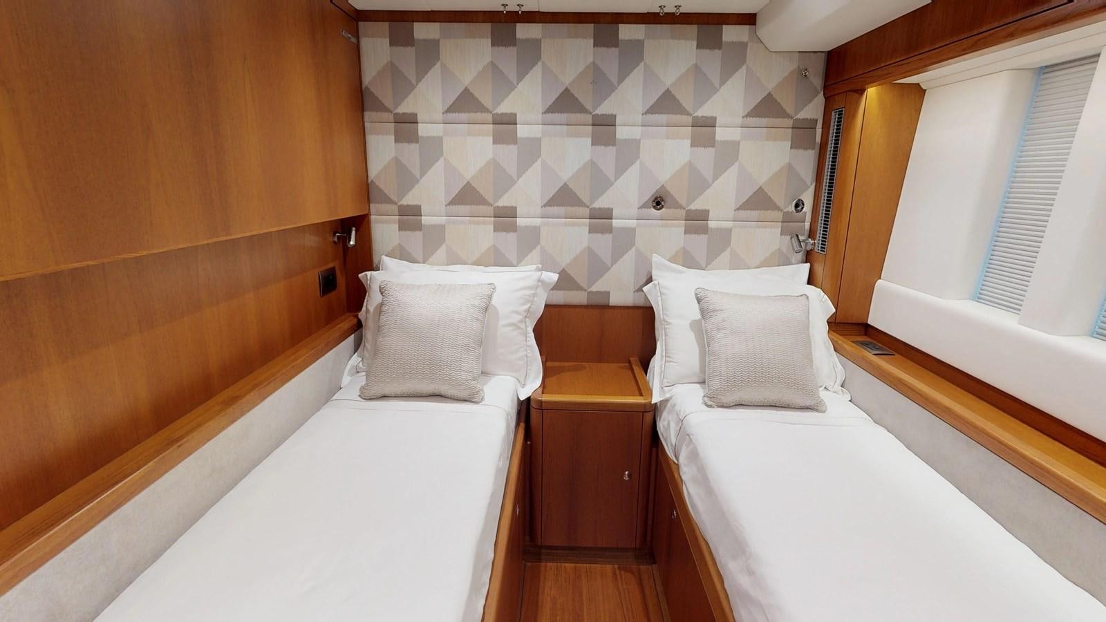 a couple of beds in a room aboard AYNI Yacht for Sale