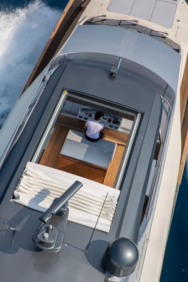 a person standing in front of a mirror aboard CANADOS 888 EVO Yacht for Sale