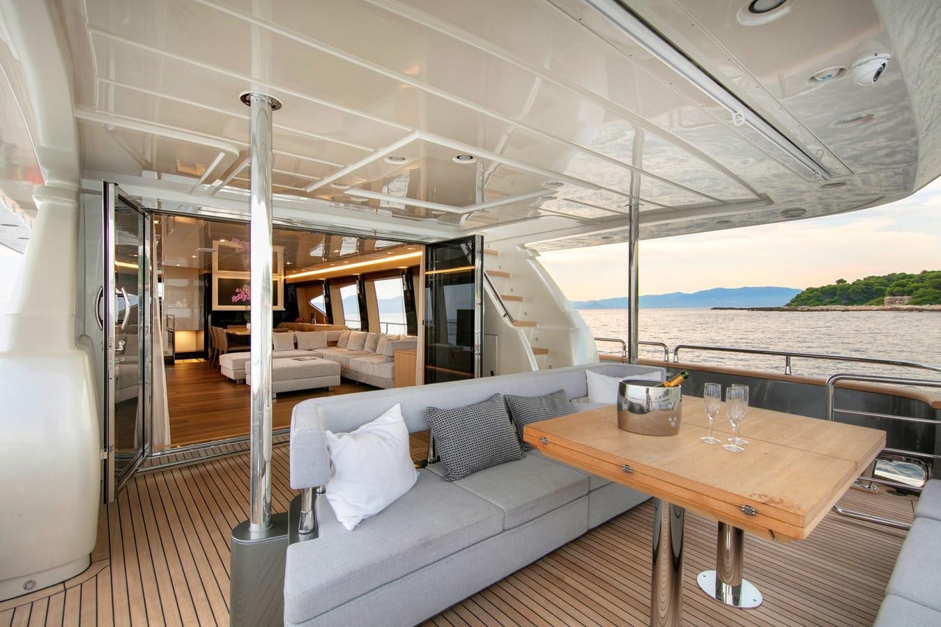 a living room with a couch and a table aboard CANADOS 888 EVO Yacht for Sale