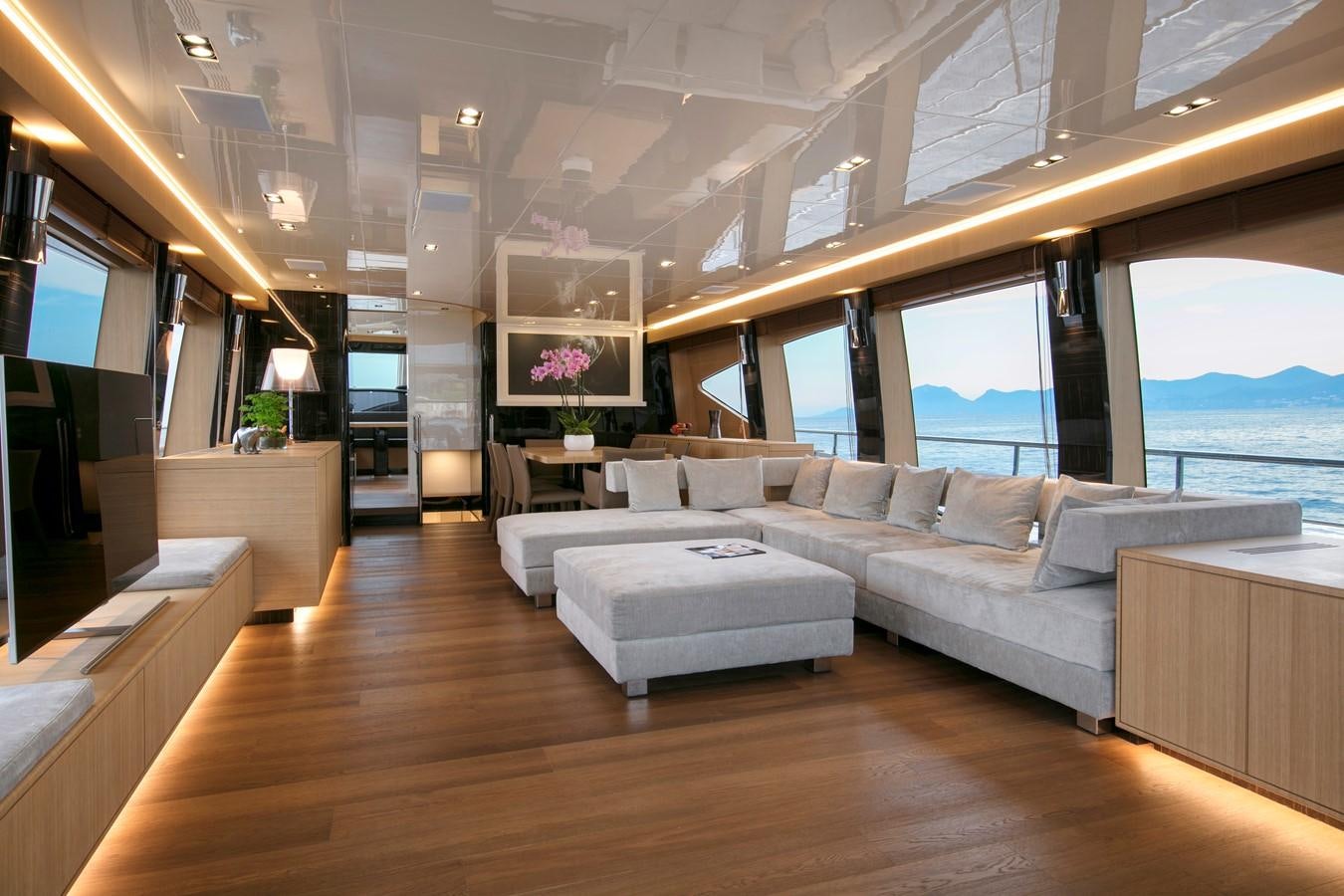 a living room with a large window aboard CANADOS 888 EVO Yacht for Sale