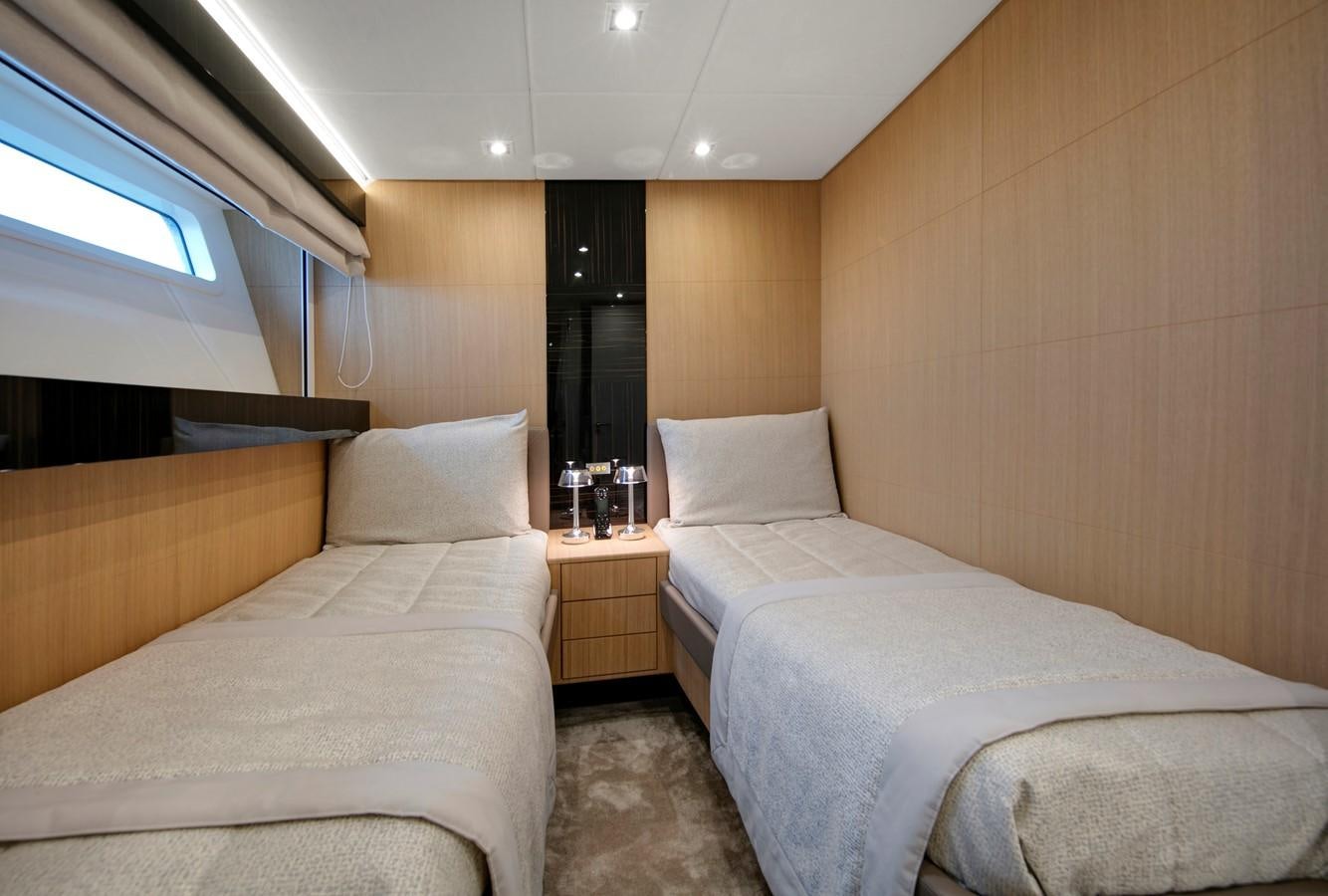 a room with two beds aboard CANADOS 888 EVO Yacht for Sale