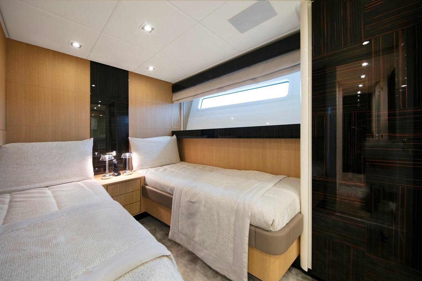 a room with two beds aboard CANADOS 888 EVO Yacht for Sale