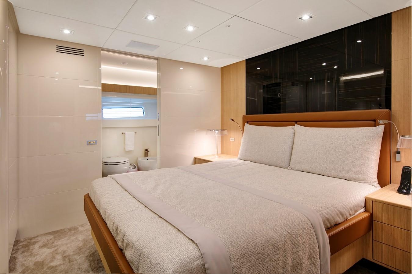 a bed in a room aboard CANADOS 888 EVO Yacht for Sale