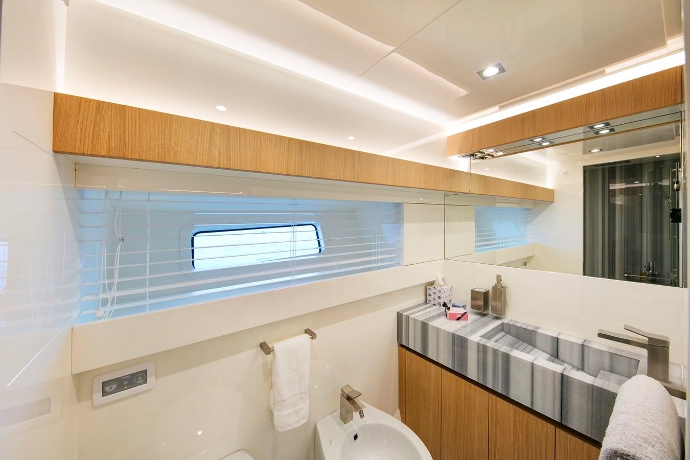 a bathroom with a sink and a mirror aboard CANADOS 888 EVO Yacht for Sale