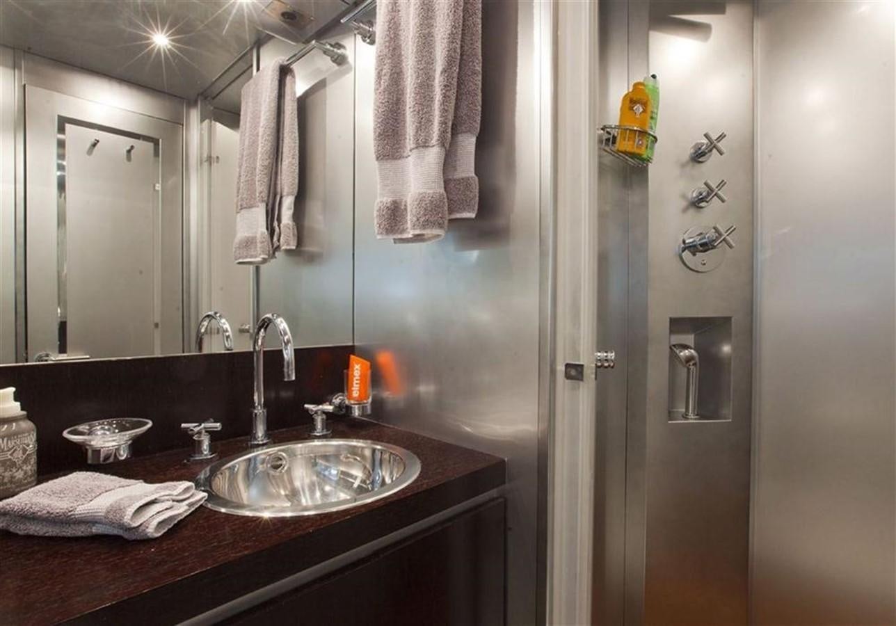 a bathroom with a sink and a mirror aboard ZAMBOANGA Yacht for Sale