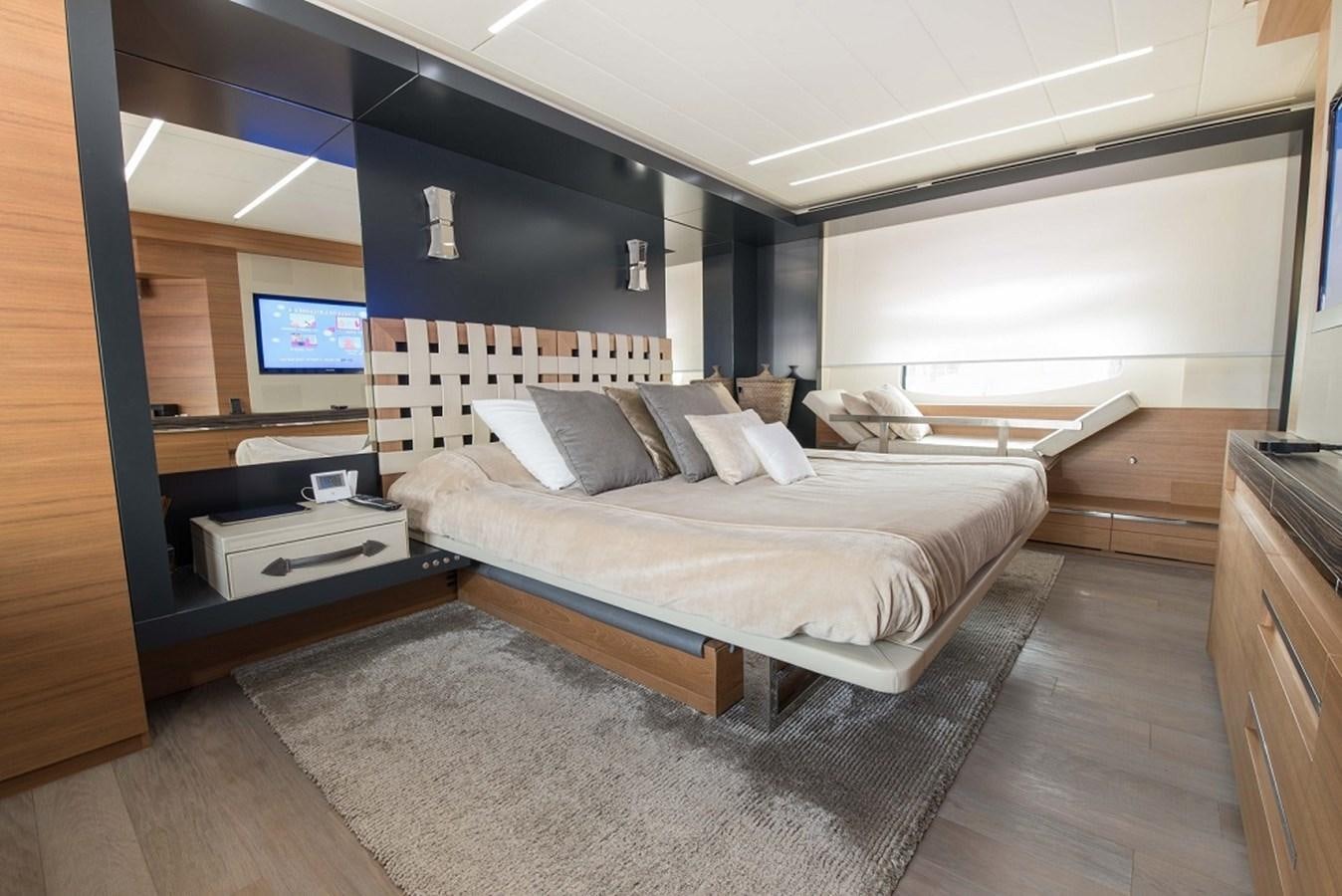 a room with a bed and a tv aboard DORIS V Yacht for Sale