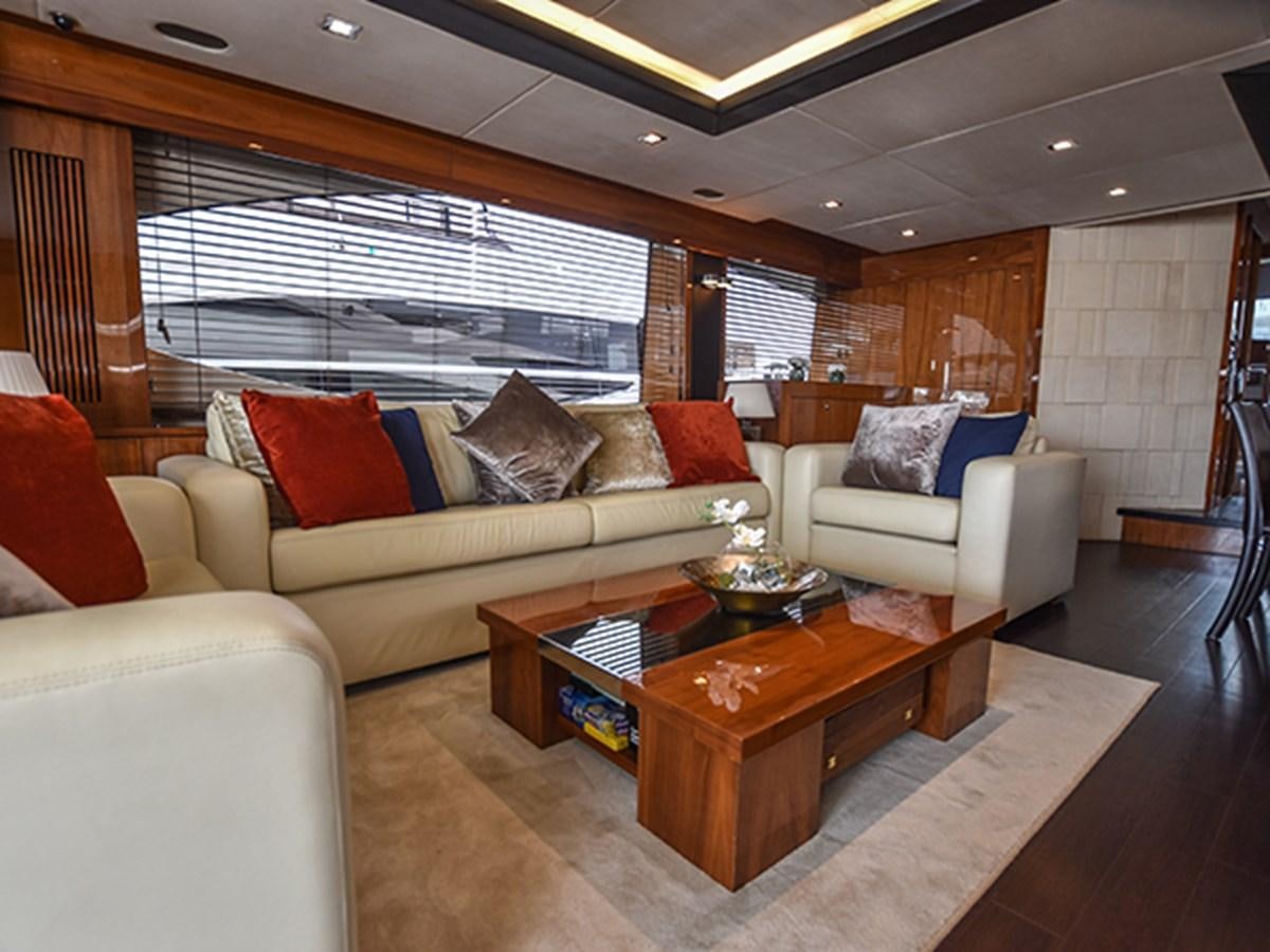 a living room with a couch and a coffee table aboard KYRENIA Yacht for Sale