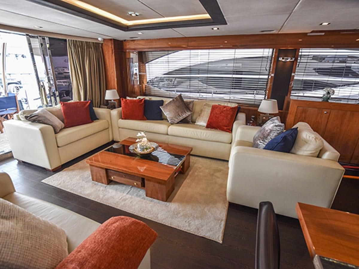 a living room with a couch and a coffee table aboard KYRENIA Yacht for Sale