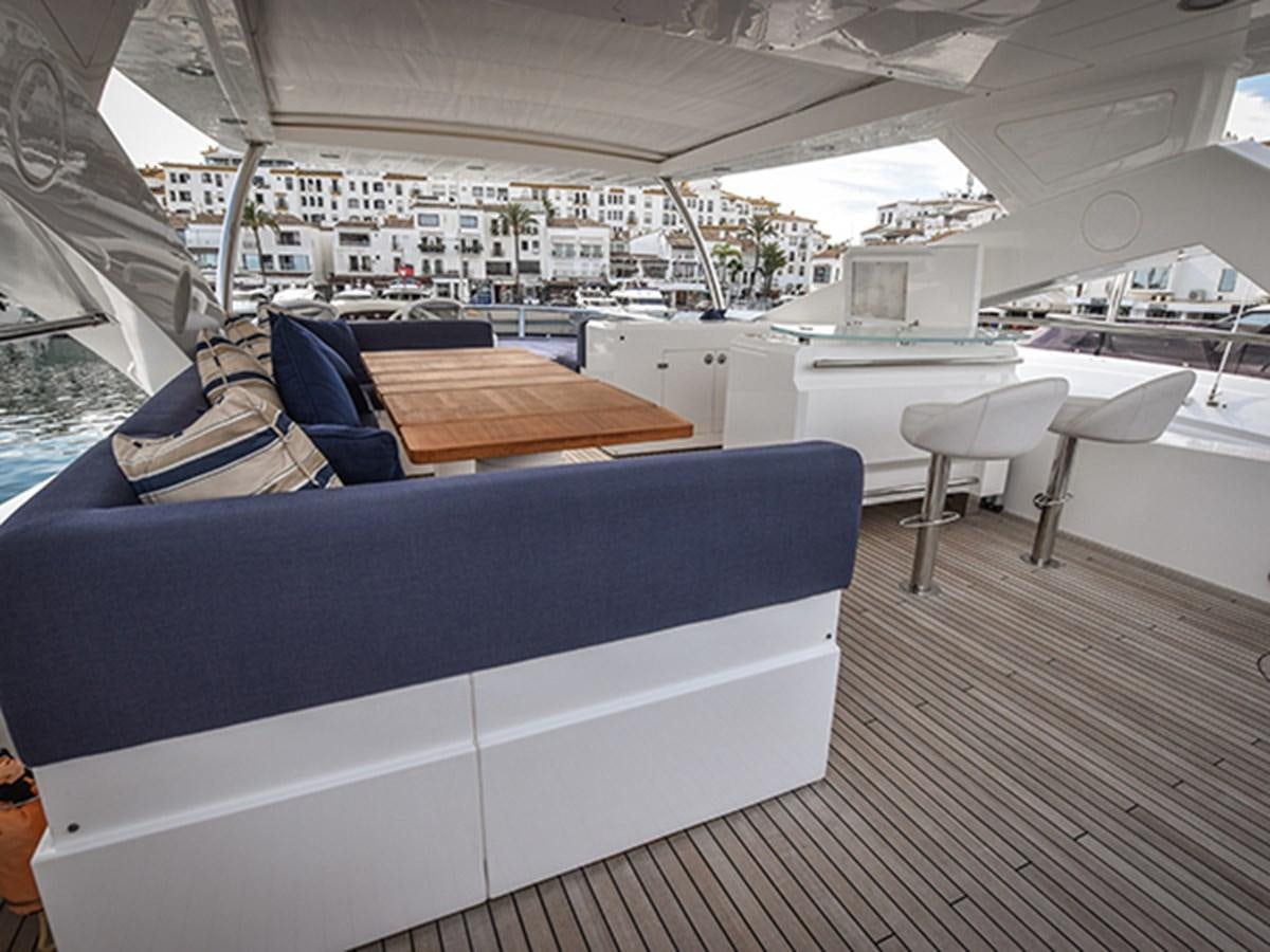 a boat with a table and chairs aboard KYRENIA Yacht for Sale
