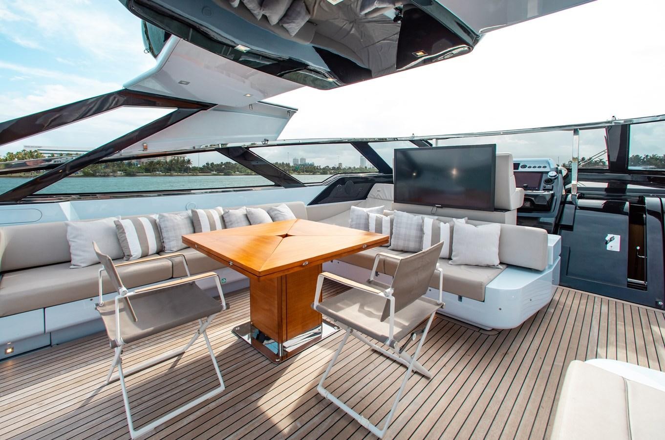 a living room with a table and chairs aboard AMARA  Yacht for Sale