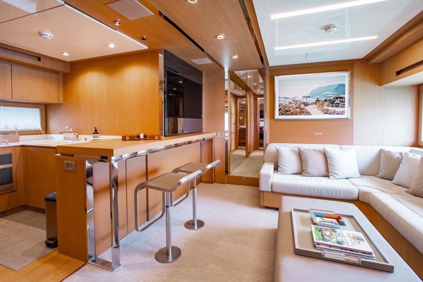 a living room with a couch and a table aboard AMARA  Yacht for Sale