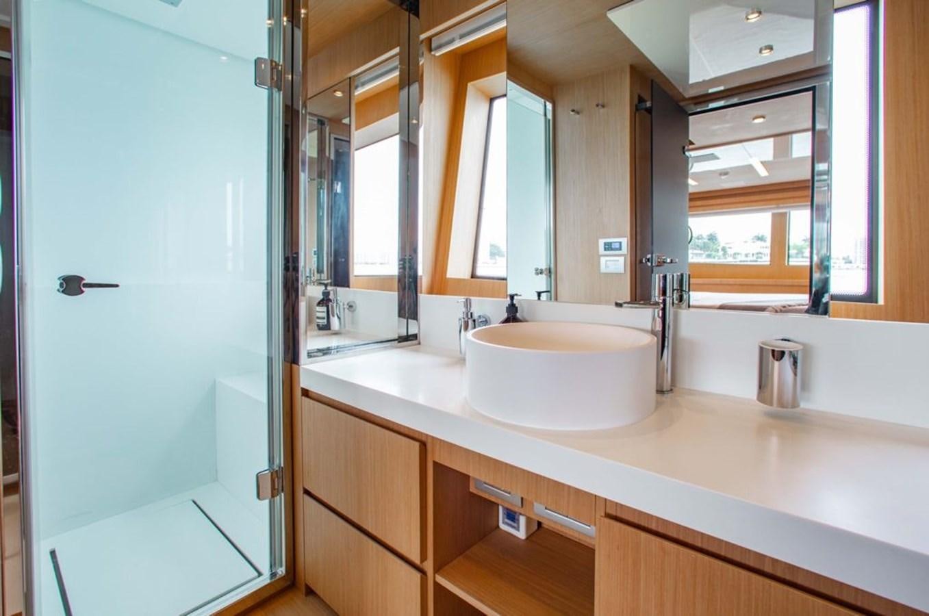 a bathroom with a sink and a mirror aboard AMARA  Yacht for Sale