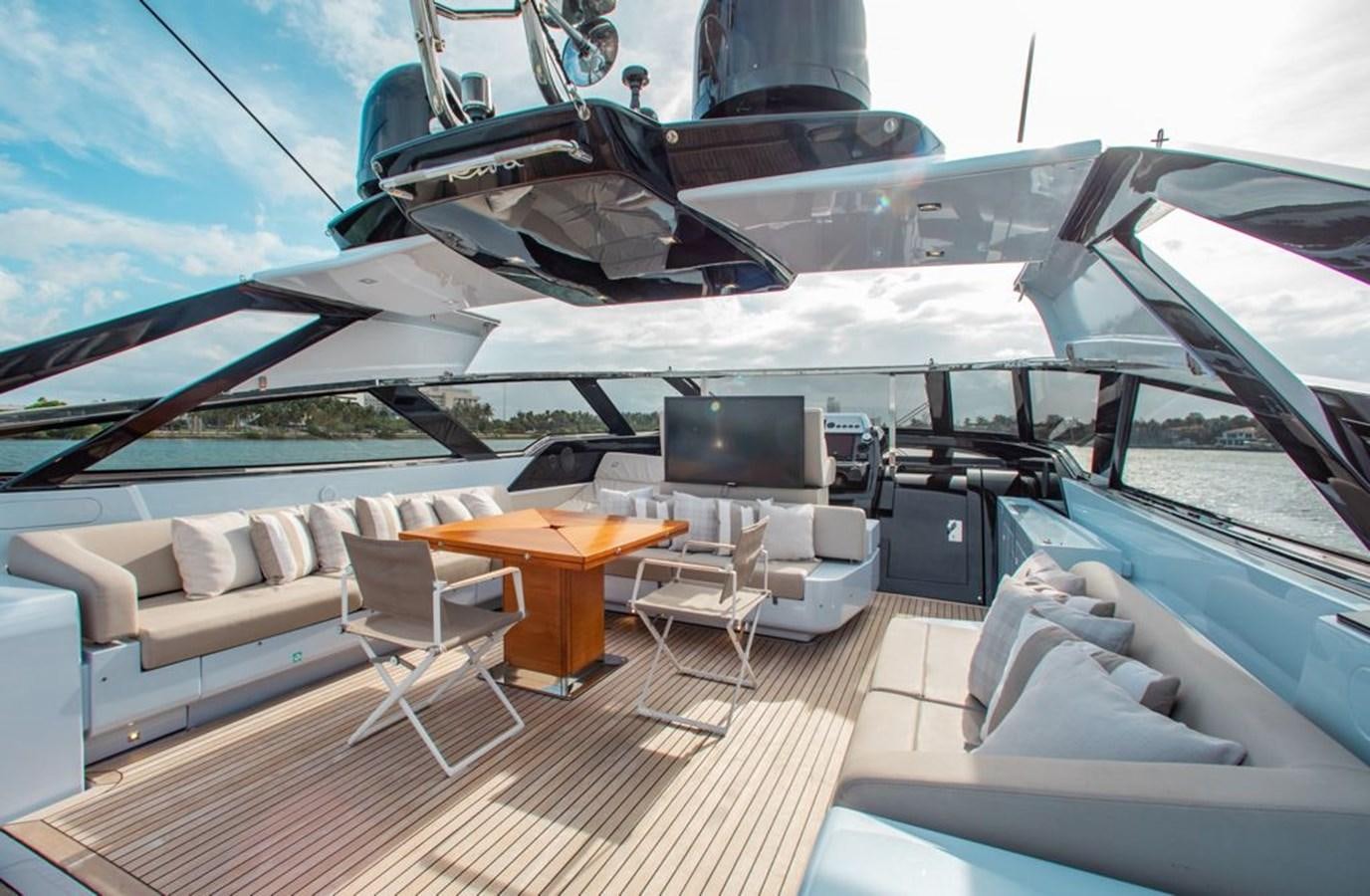 a yacht with a table and chairs aboard AMARA  Yacht for Sale