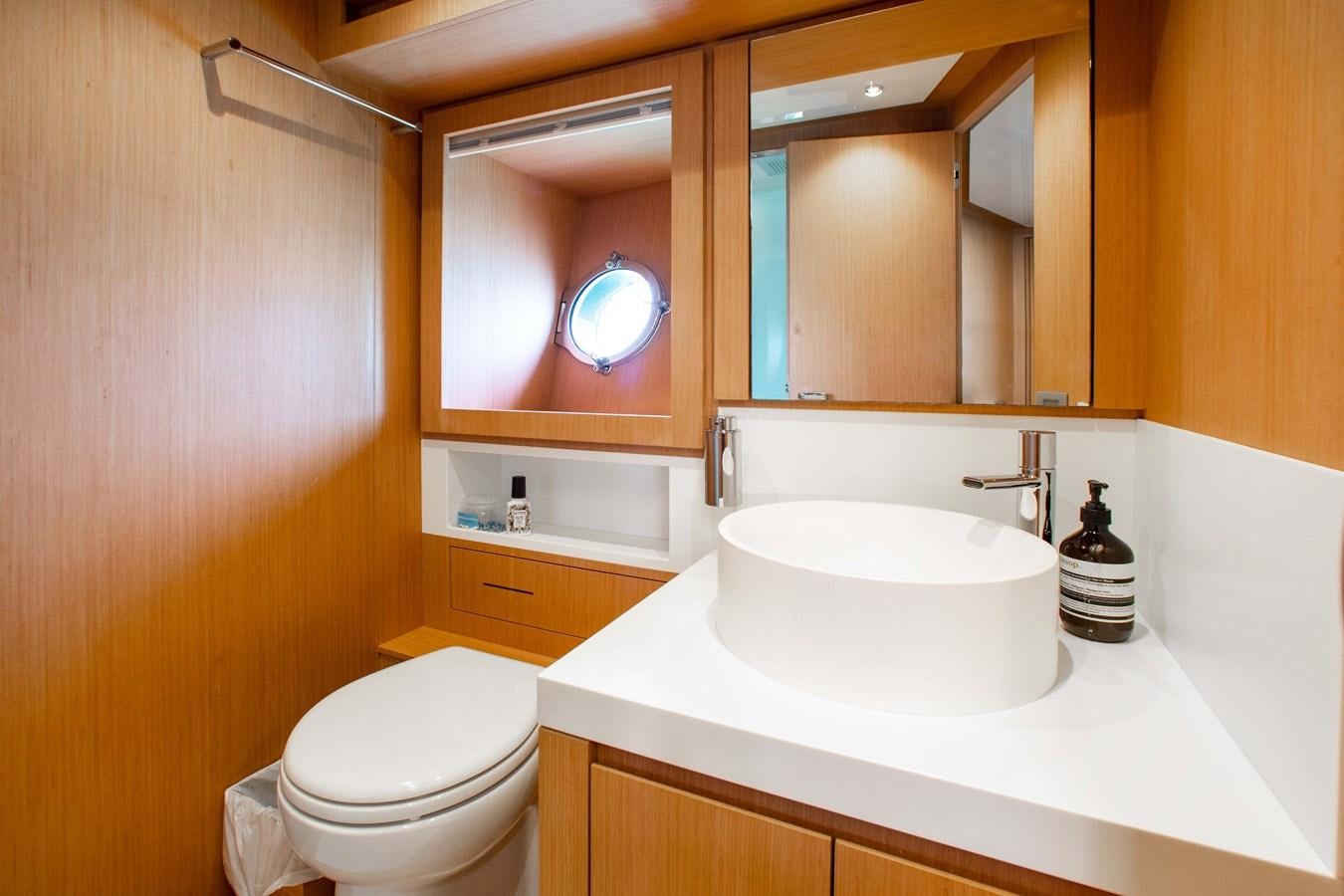 a bathroom with a sink and toilet aboard AMARA  Yacht for Sale