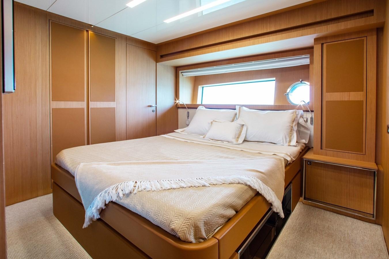 a bed in a room aboard AMARA  Yacht for Sale