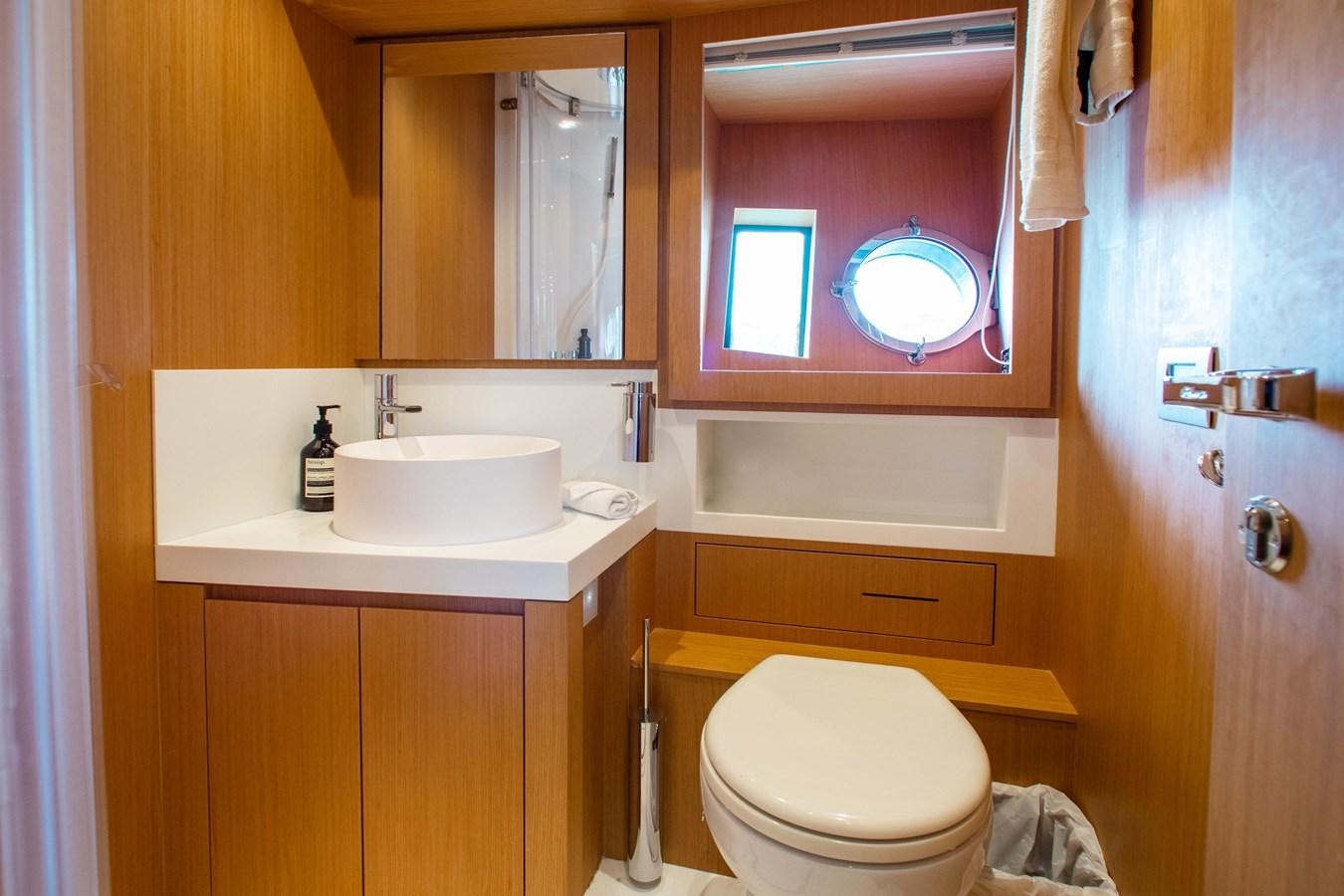 a bathroom with a sink and toilet aboard AMARA  Yacht for Sale