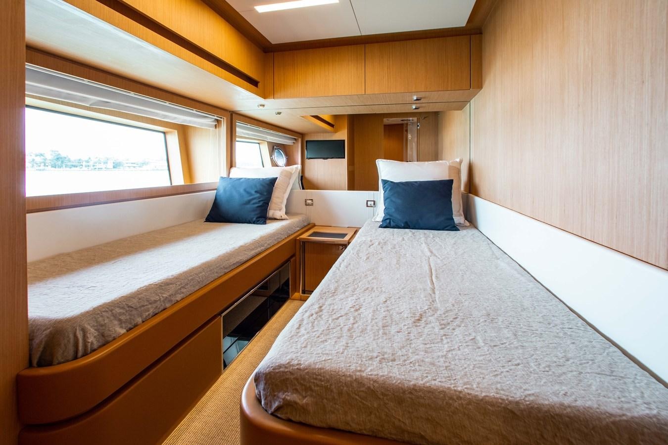 a room with two beds aboard AMARA  Yacht for Sale