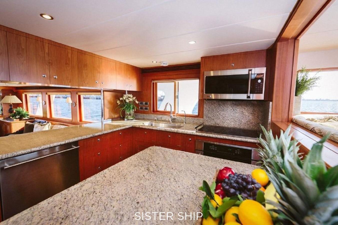 a kitchen with a large island aboard 880 CPMY Yacht for Sale