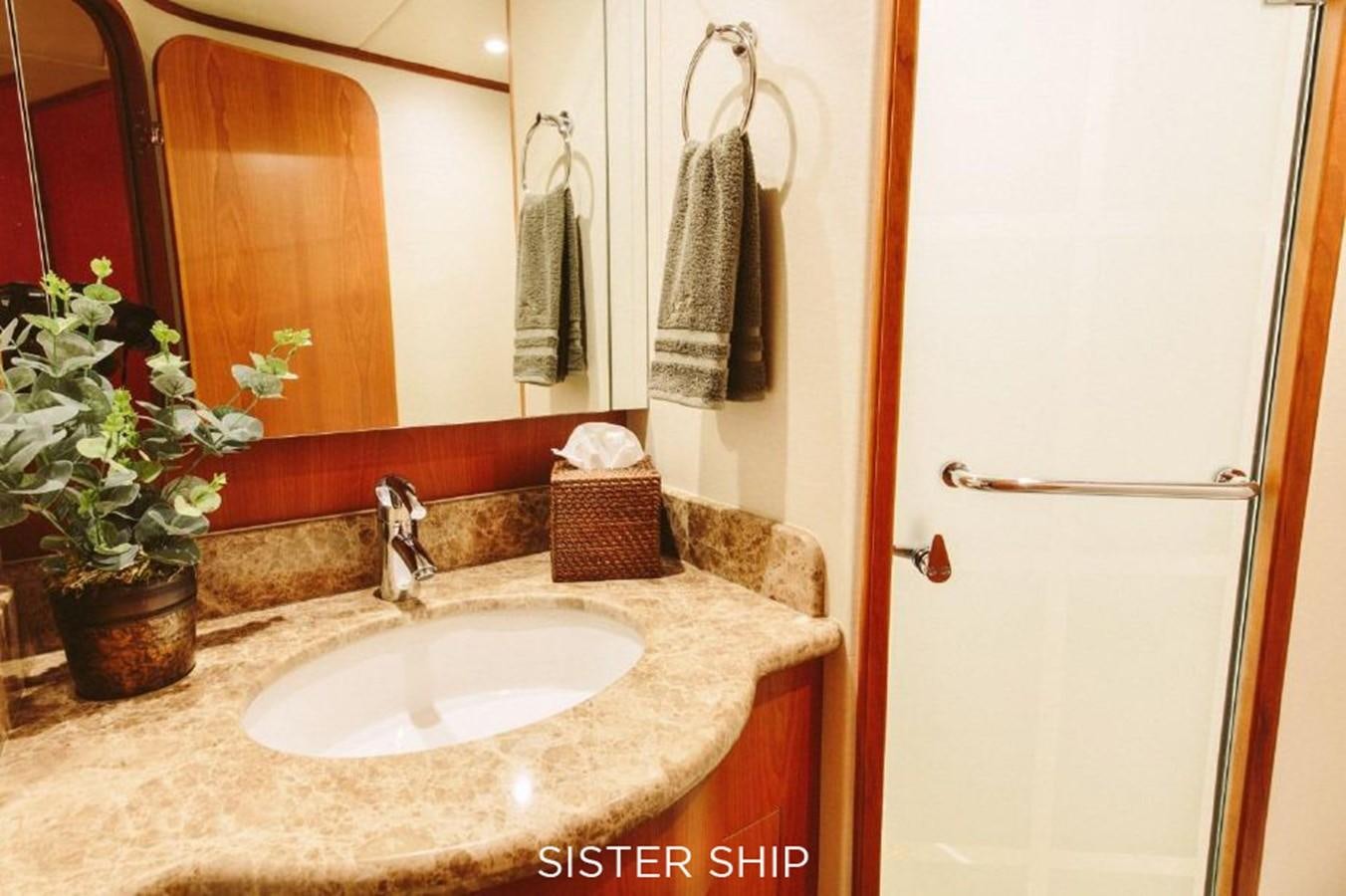 a bathroom with a sink and mirror aboard 880 CPMY Yacht for Sale