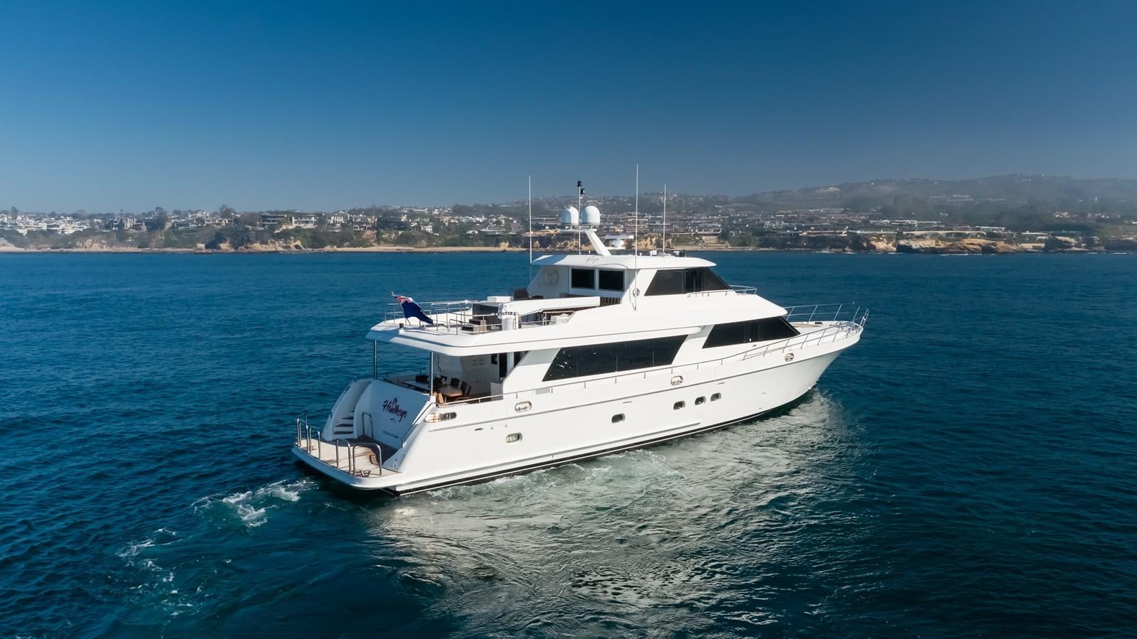 a white yacht on the water aboard HAWK EYE  Yacht for Sale