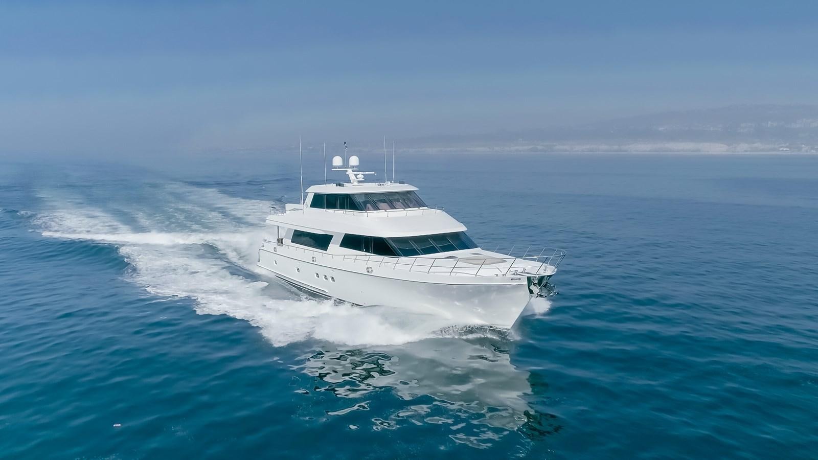 a white boat on the water aboard HAWK EYE  Yacht for Sale