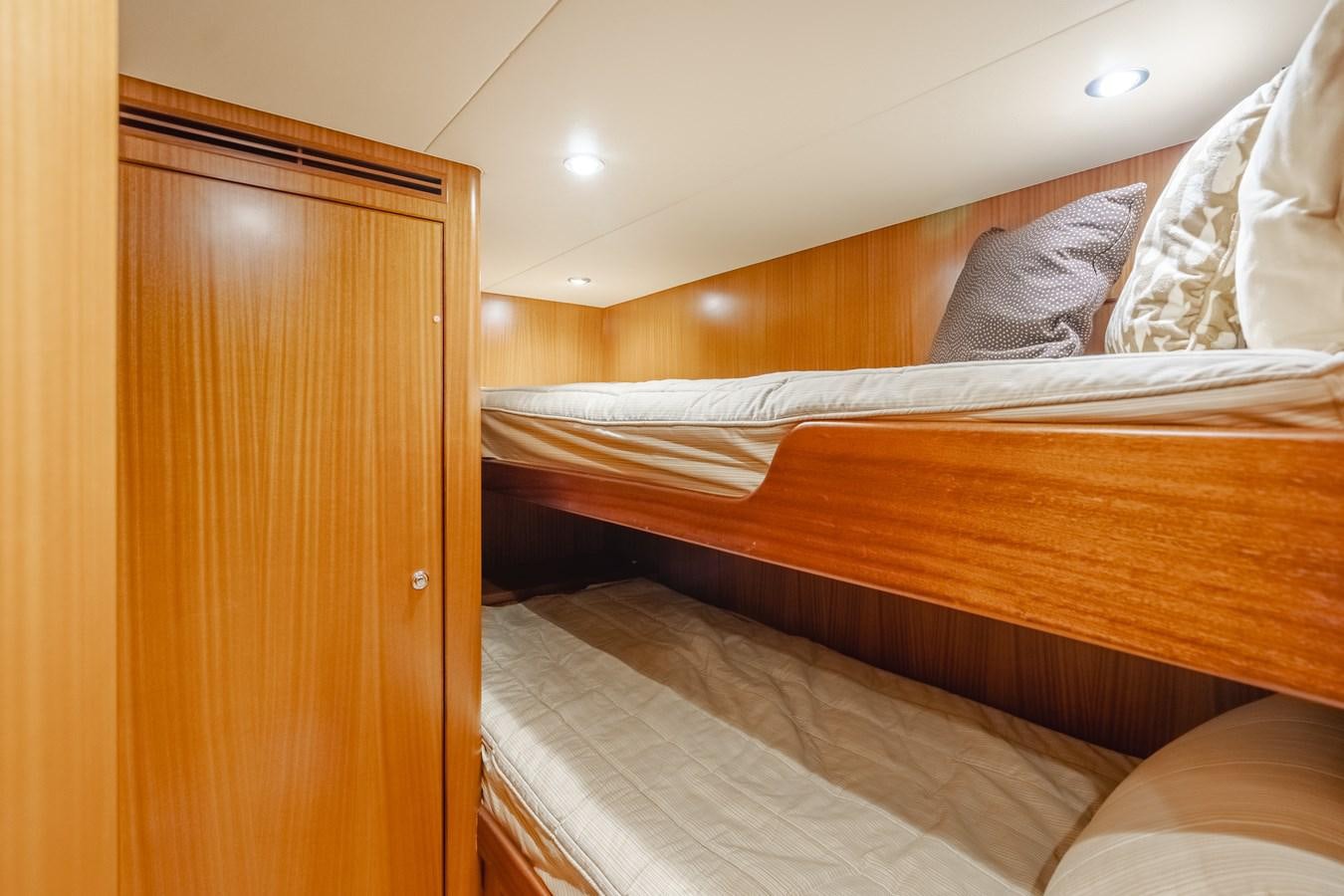 a room with a bed and a closet aboard HAWK EYE  Yacht for Sale