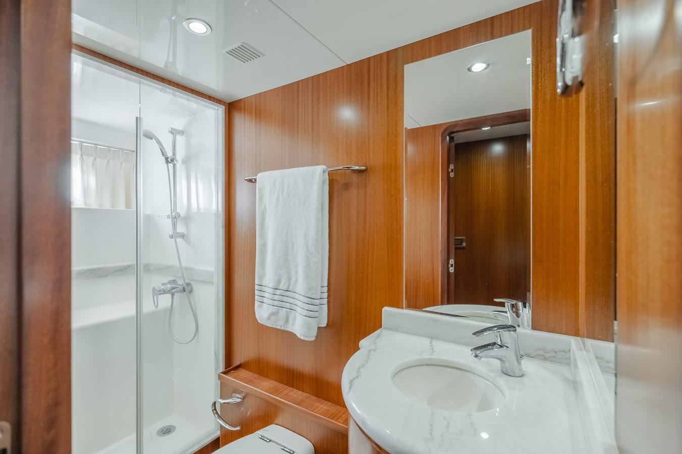 a bathroom with a sink and shower aboard HAWK EYE  Yacht for Sale