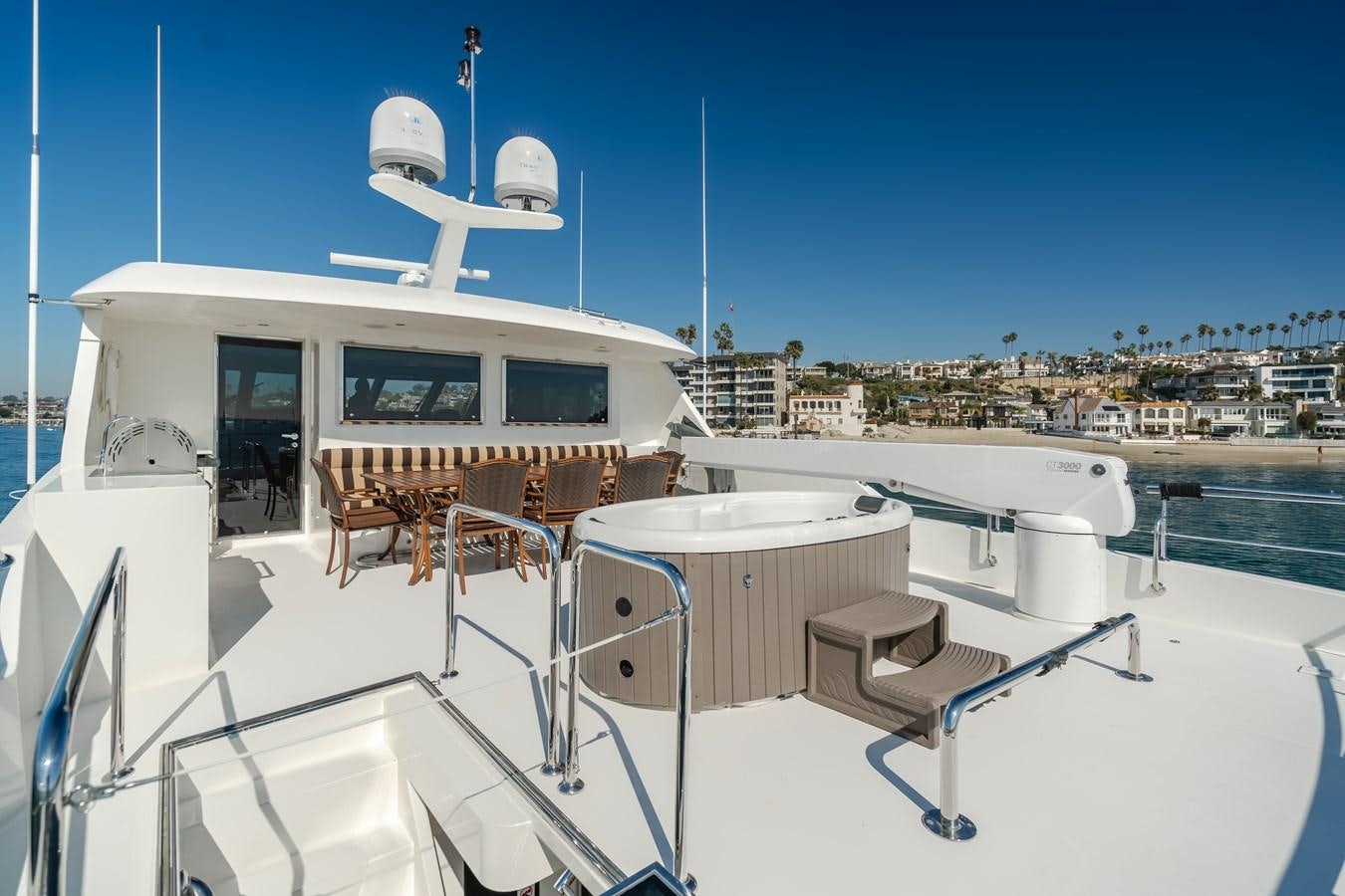 a white boat with a satellite dish on it aboard HAWK EYE  Yacht for Sale