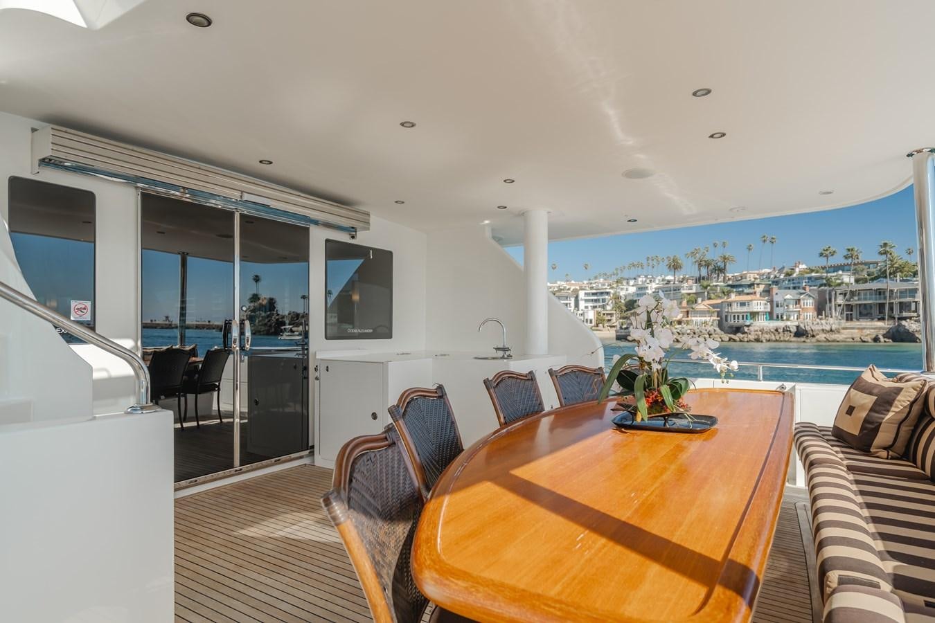 a living room with a table and chairs aboard HAWK EYE  Yacht for Sale